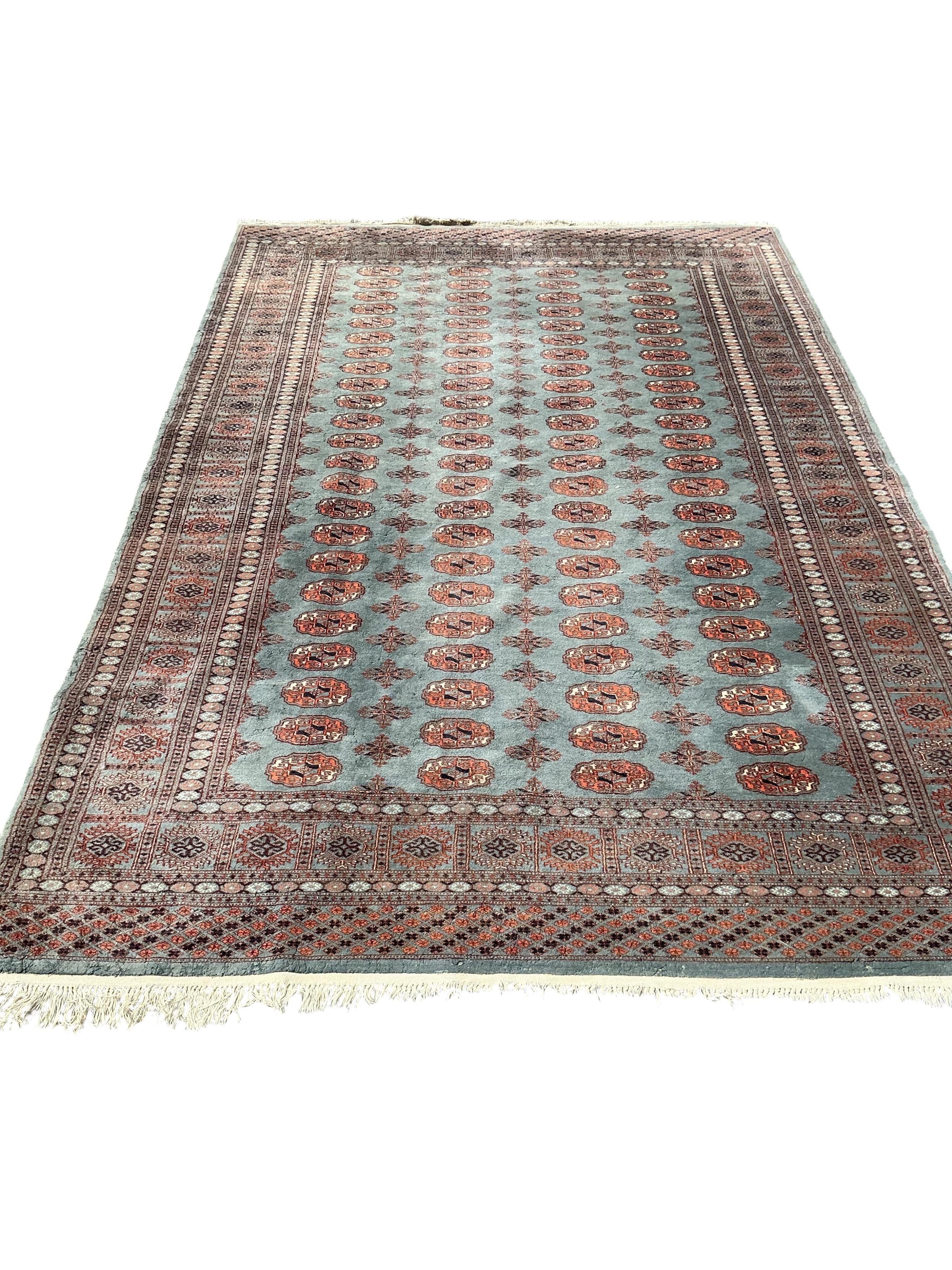 A Bokhara carpet and a smaller Caucasian style rug, larger 290 x 186cm